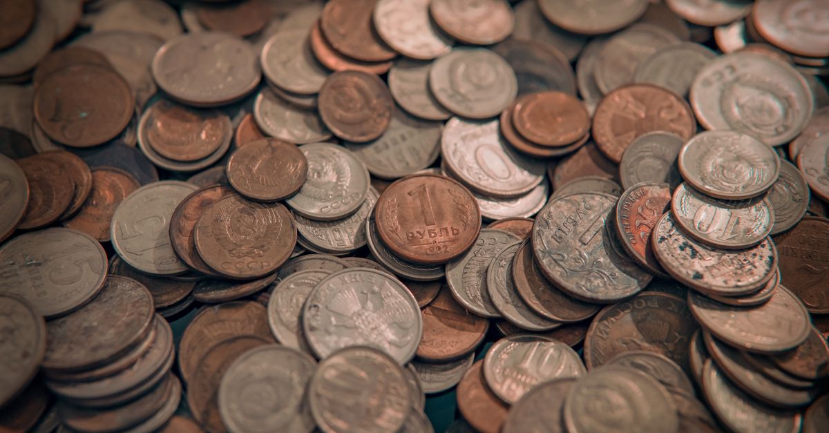 macro shot comparison of 1943 silver nickel mint mark vs 1964 nickel mint mark