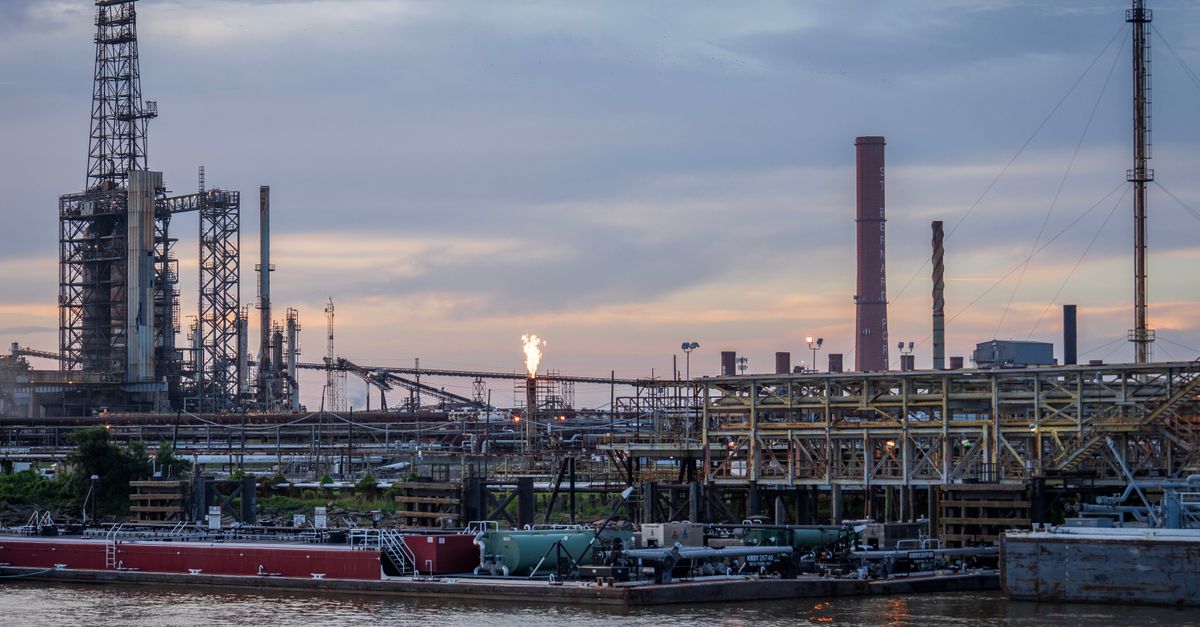 oil refinery sunset digital data overlay