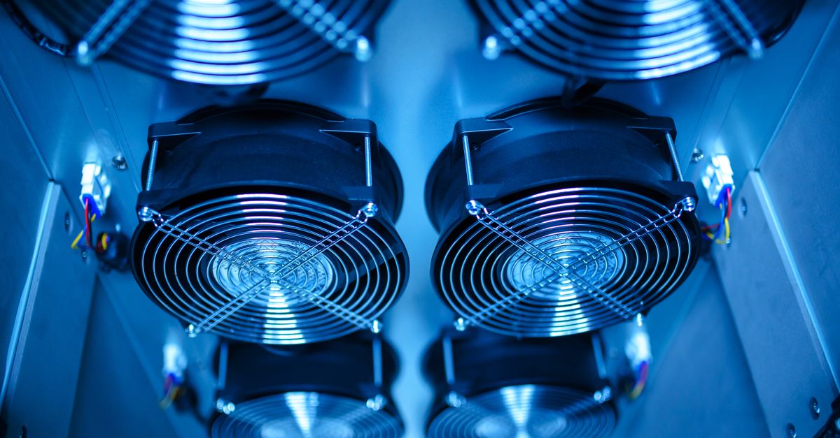 high-tech liquid cooling system inside a data center with glowing blue pipes